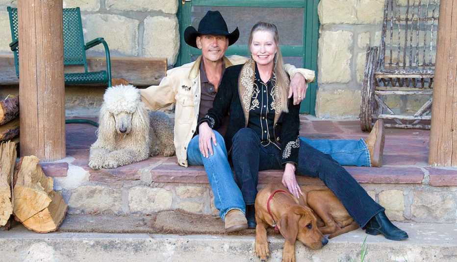 Lisa Swayze poses with her late husband, Patrick, and two dogs