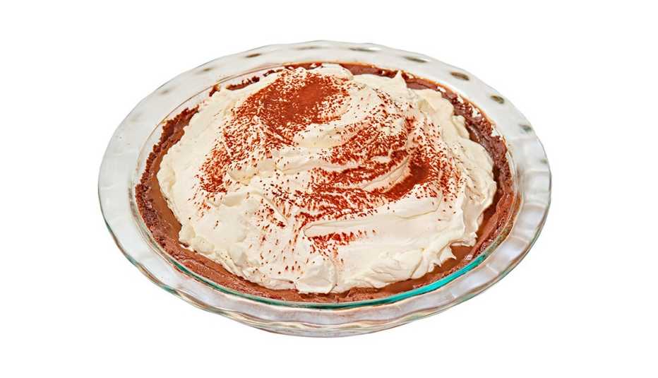 chocolate cream pie in a glass pie plate