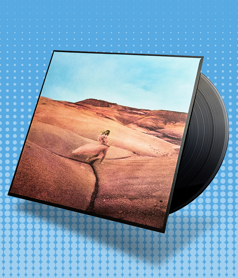 album cover with record sticking out of it; cover shows woman outside under blue sky; blue background with little shapes on it