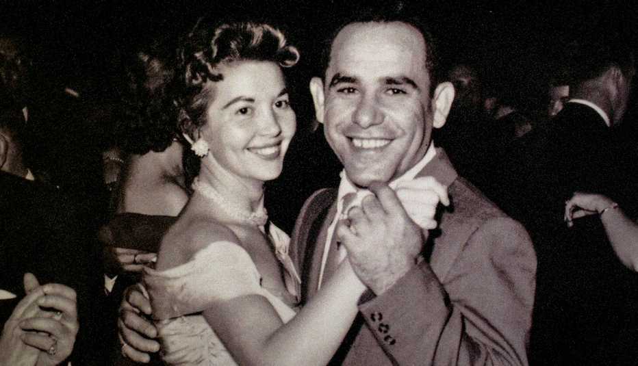 carmen berra and yogi berra dancing, surrounded by other people who are also dancing