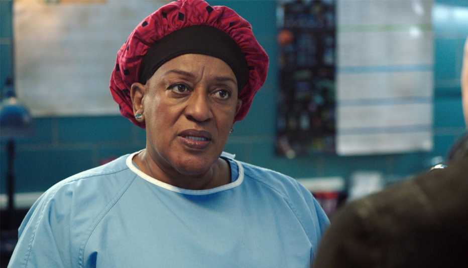 cch pounder wearing scrubs as dr. loretta wade in ncis: new orleans