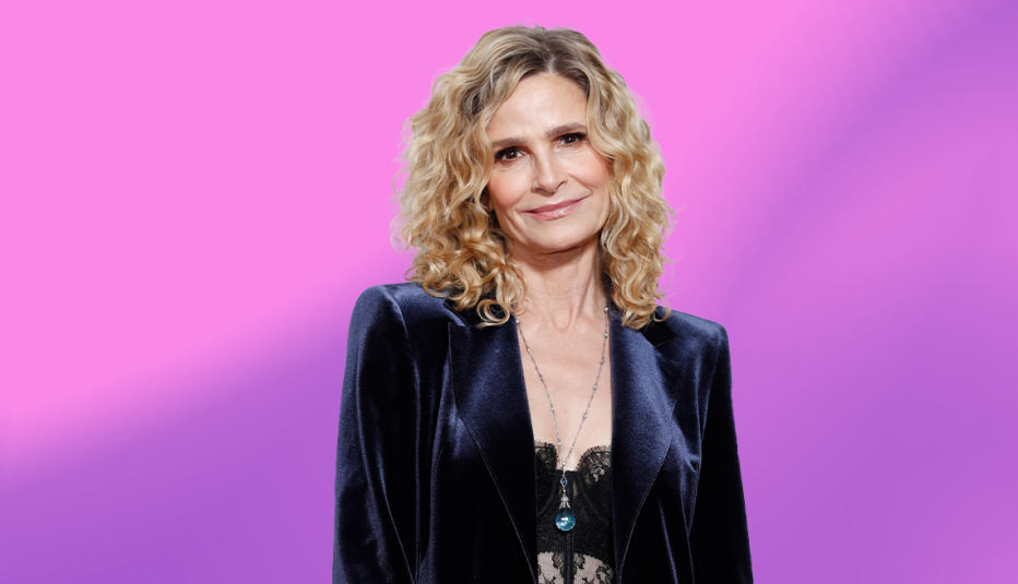 kyra sedgwick against purple ombre background