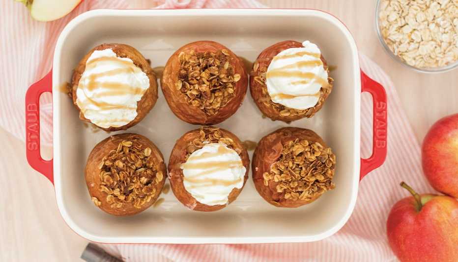 baked apples with oat crumble on all and fluffy white topping on half