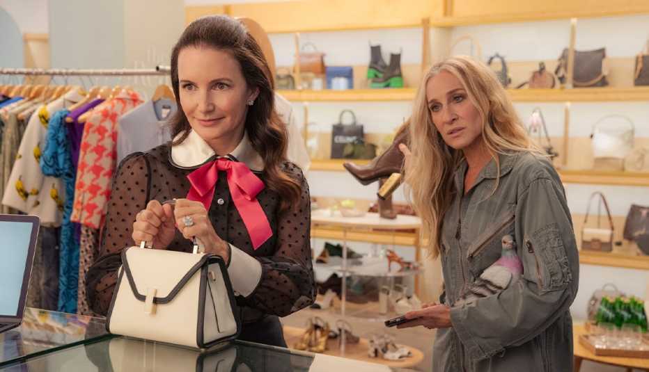kristin davis as charlotte york and sarah jessica parker as carrie bradshaw in a store in a still from and just like that