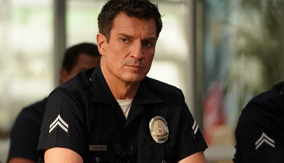 nathan fillion as john nolan in police uniform in still from the rookie