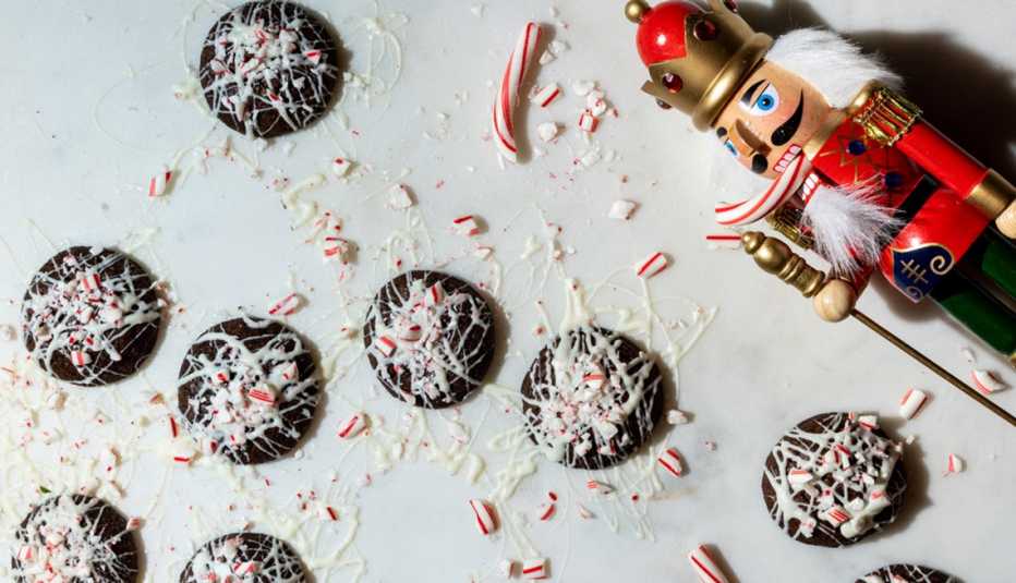 chocolate cookies with peppermint candies and white chocolate drizzled on top