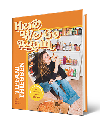 cover of here we go again cookbook with tiffani thiessen eating pizza in front of open fridge
