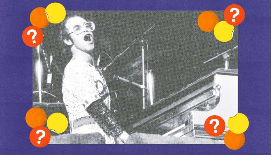 Elton John playing piano and singing, surrounded by orange, yellow and red circles with question marks in them