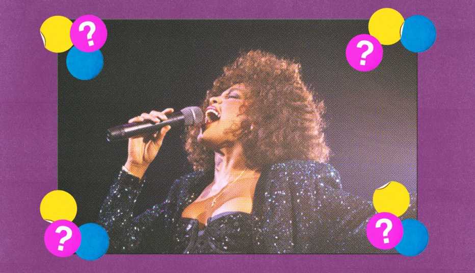 Whitney Houston singing into microphone; surrounded by yellow, blue and purple circles with question marks in them on purple background