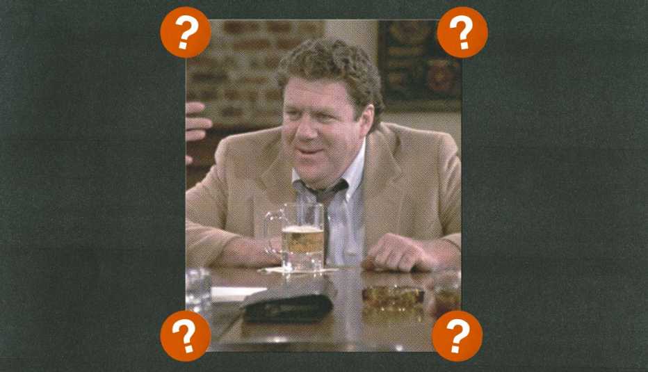 george wendt as norm on cheers; surrounded by red circles with question marks in them
