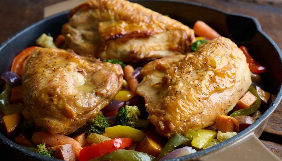 chicken thighs and veggies in pan