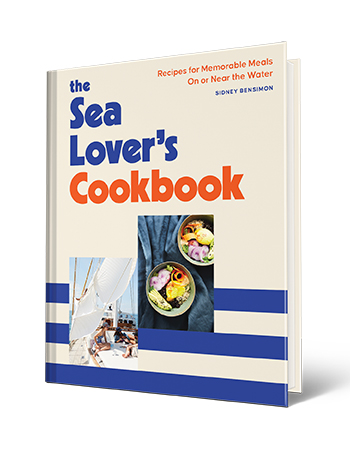 Book cover that says The Sea Lover’s Cookbook Recipes for Memorable Meals on or Near the Water, Sidney Bensimon; picture of people on boat on cover; another picture of two bowls of food on cover
