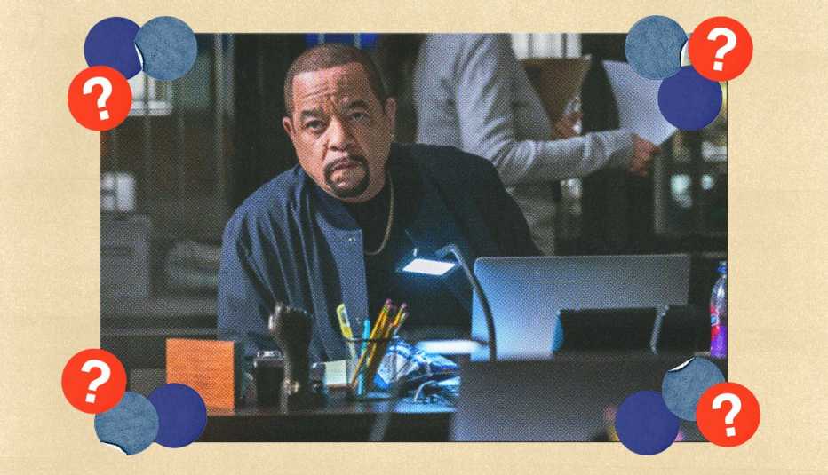 Ice-T as Sergeant Adafin Fin Tutuola sitting at a desk in a still from Law & Order S V U; surrounded by blue, dark blue and red circles with question marks in them