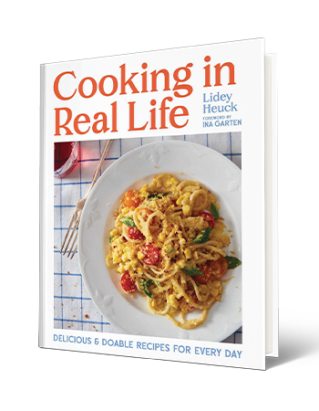 book cover that says cooking in real life, lidey heuck, foreword by ina garten