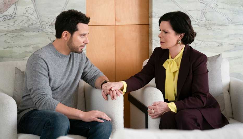 Marcia Gay Harden sitting next to Skylar Astin in a still from So Help Me Todd