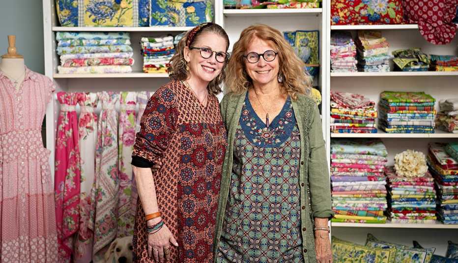melissa gilbert and april cornell standing in front of shelves of clothes