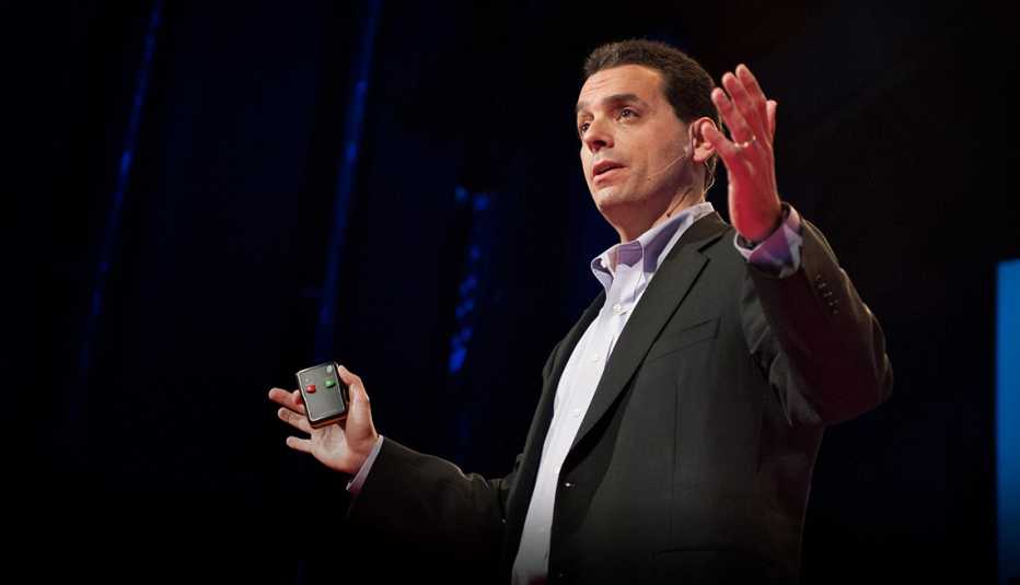 daniel pink standing with arms bent and out to sides