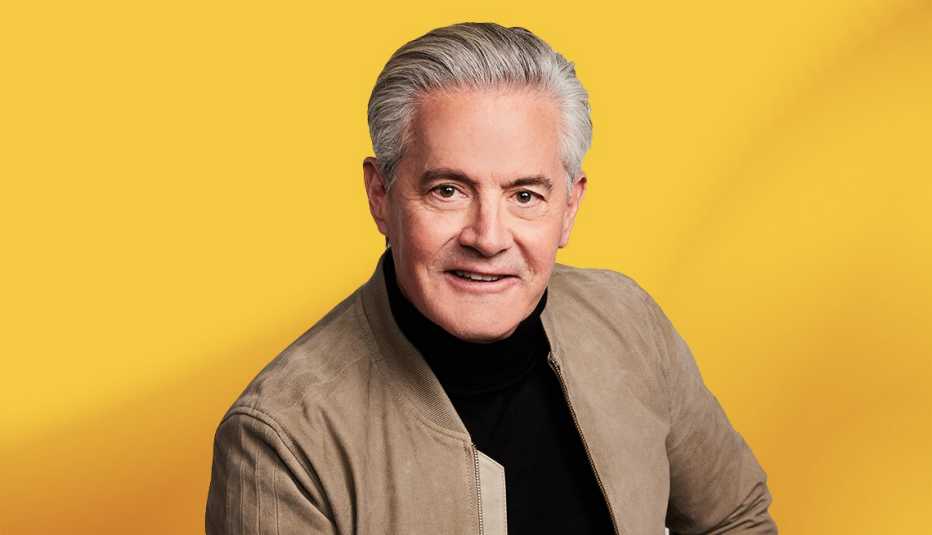 Kyle Maclachlan against yellow ombre background