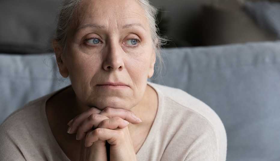 middle aged woman looking pensive