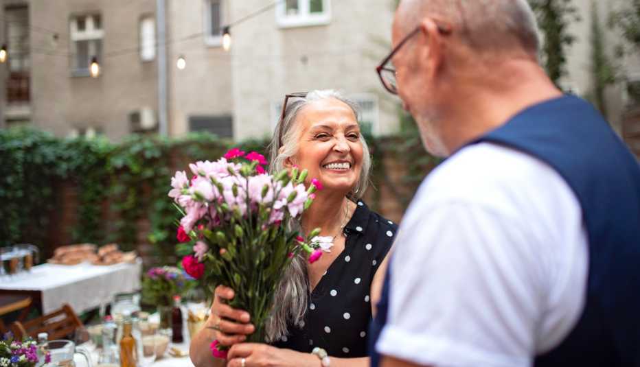 a man giving a woman flowers for caregivers day
