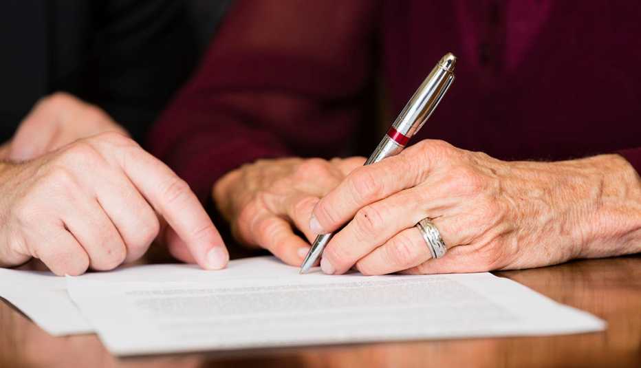 woman signs a document