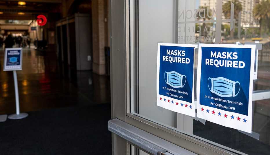 Signs inform visitors that masks are required inside the Ferry Building in San Francisco, California, U.S., on Monday, July 19, 2021. 