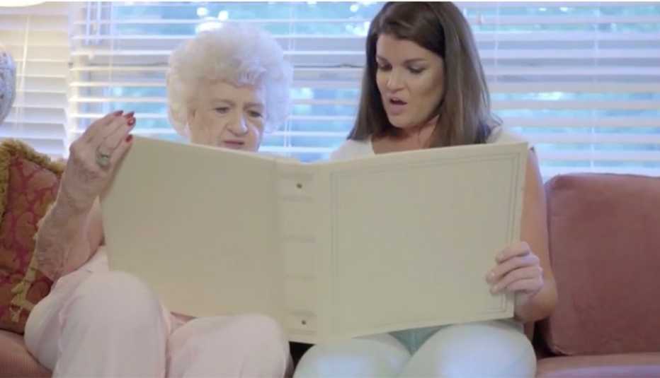 Two women looking at photo album