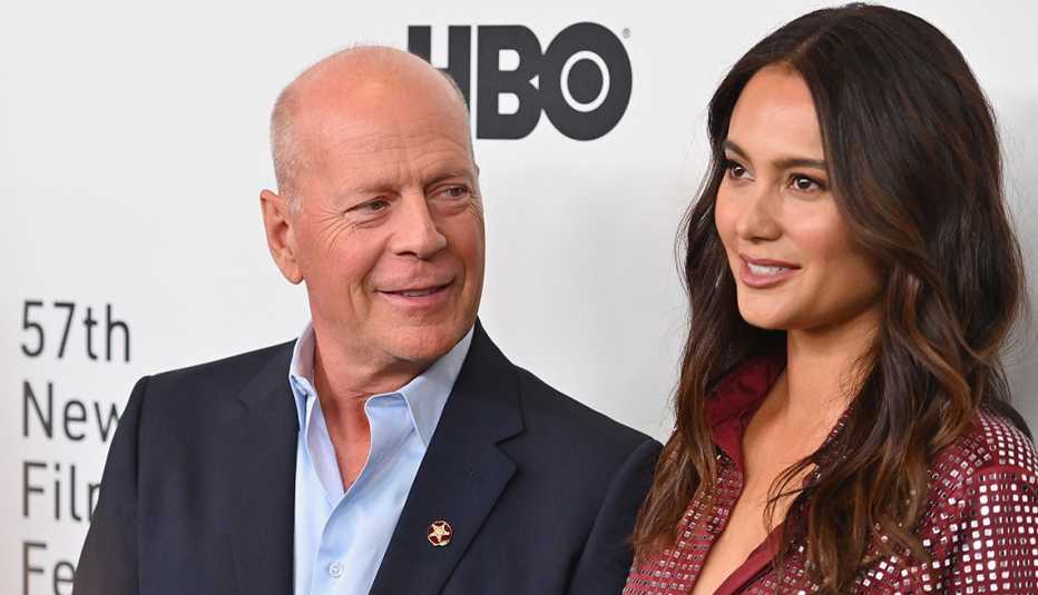 bruce willis smiles at wife emma heming willis on the red carpet in 2019.