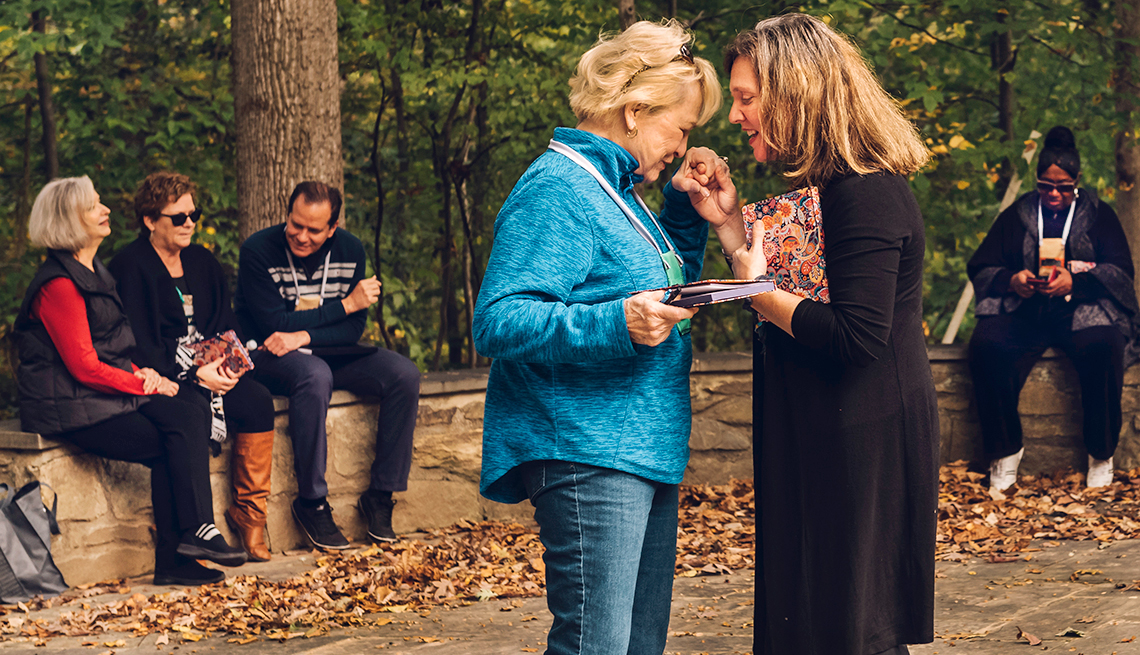 Kathryn Schafer, left, embraces with Tova Rubin, retreat leader, after a nature-based exercise about being present in one's emotions during the Caring for the Caregiver retreat held at Rockwood Manor in Potomac, Maryland. 