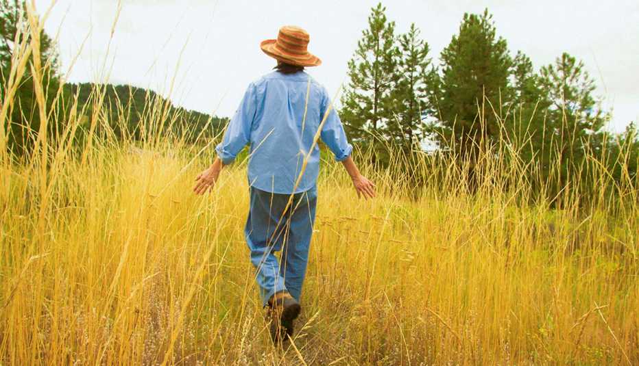 Woman Walking in Tall Yellow Grass, What Is Respite Care? A Break for the Caregiver