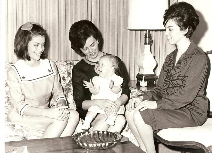 Alison Lolley on her mother's lap in 1964