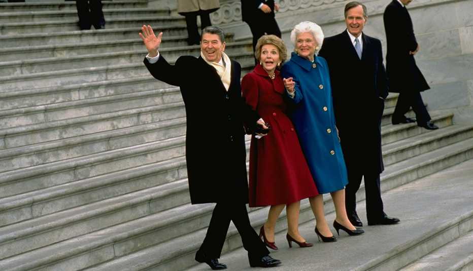 President Ronald Reagan and wife Nancy (R) walking down steps, hand-in-hand, accompanied by President George H. W. Bush and his wife Barbara, leaving the White House after eight years in office, 20 January 1989.  (Photo by Steve Liss/The LIFE Images Colle