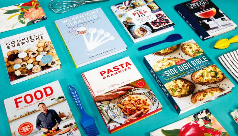 collage of cookbooks with utensils on a blue background