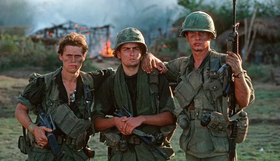 Willem Dafoe Charlie Sheen and Tom Berenger during the filming of Platoon