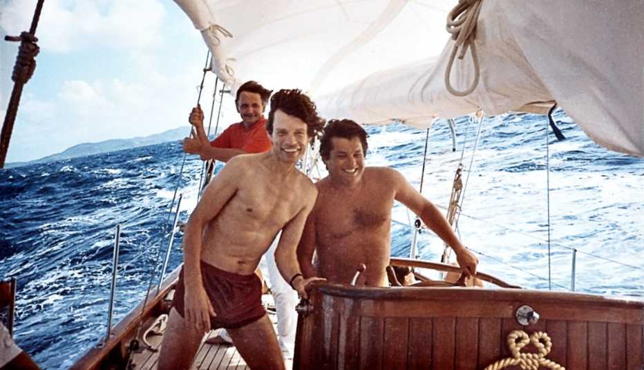  Wenner sailing with Mick Jagger in Mustique, 1985