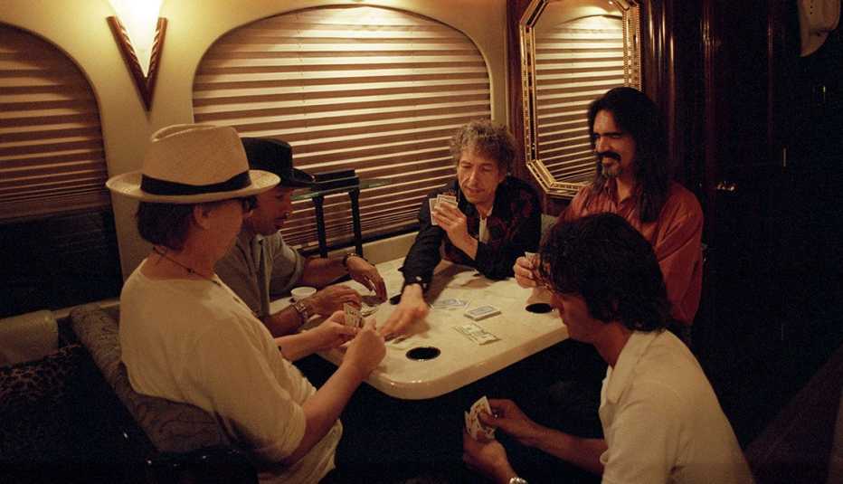 playing a card game clockwise from left david kemper tony garnier bob dylan larry campbell and charlie sexton