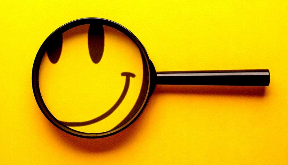 a smiling face under a magnifying glass