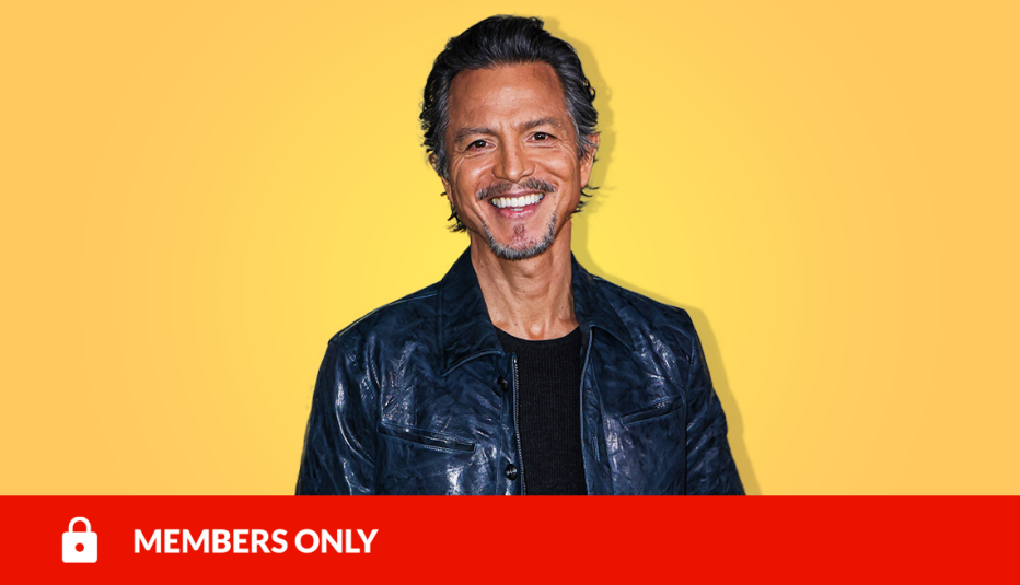 benjamin bratt smiling against yellow background; red members only banner with lock icon on bottom