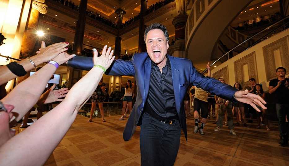 Actor Donny Osmond Greats A Crowd Of Fans, AARP Entertainment, How Celebrities Face Their Worst Fears 