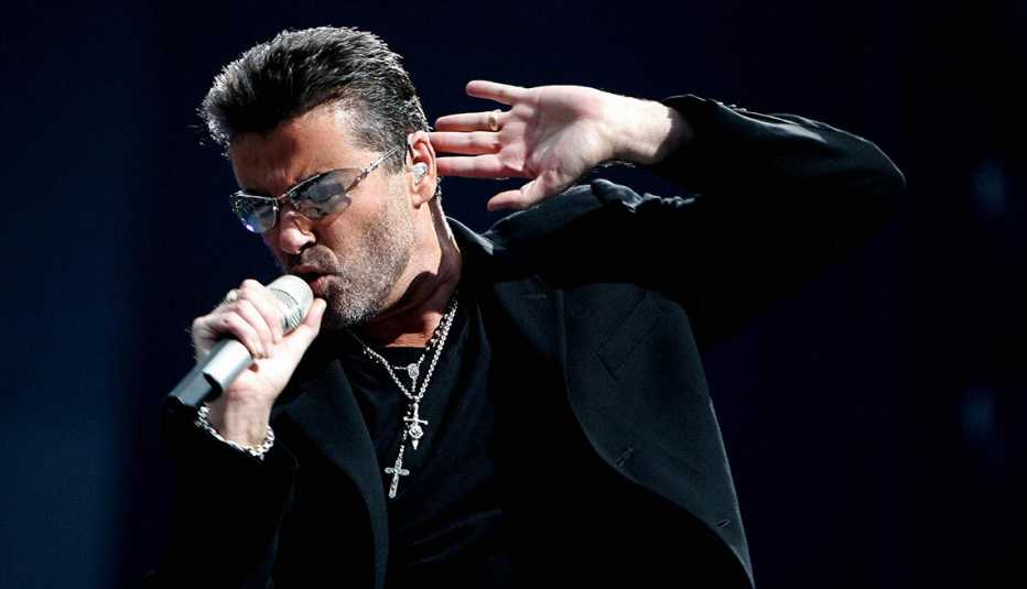 British singer George Michael performs during a concert in Amsterdam, 26 June 2007.