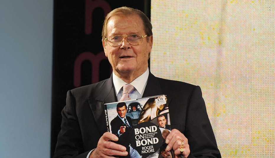 Sir Roger Moore meets fans and signs copies of his book 'Bond on Bond' at HMV, Oxford Street on October 22, 2012 in London, England.