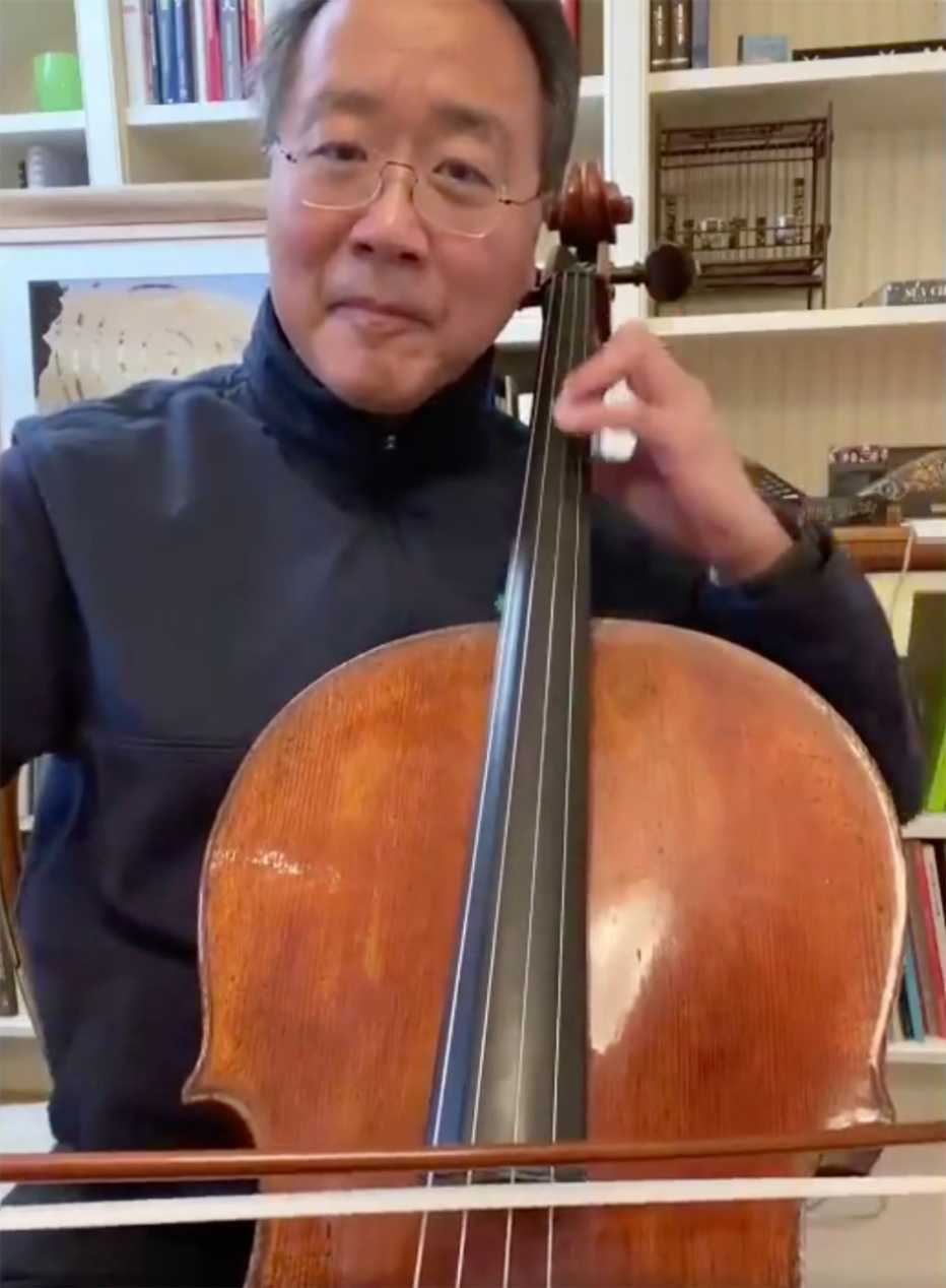 Classical musician Yo Yo Ma performing with his cello inside his home