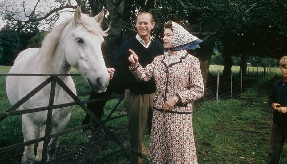 Queen Elizabeth II and Prince Philip visit a farm on the Balmoral estate in Scotland in 1972