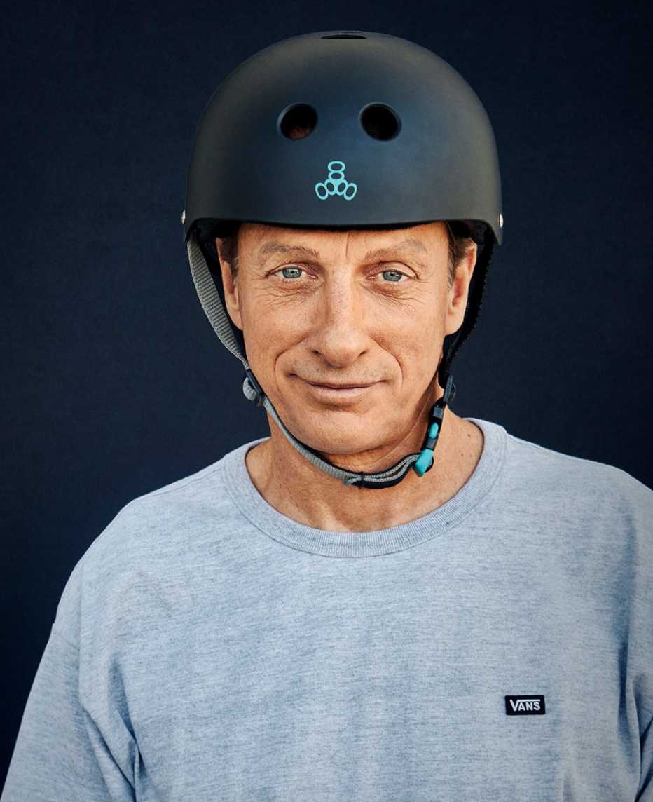 A close-up of skateboarding legend Tony Hawk wearing a helmet
