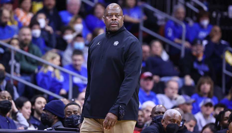 Georgetown head coach Patrick Ewing standing on the sidelines during a college basketball game against the Seton Hall Pirates