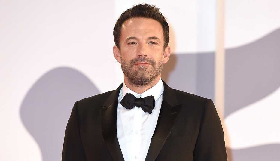 Actor Ben Affleck wearing a tuxedo on the red carpet at the 78th Venice International Film Festival