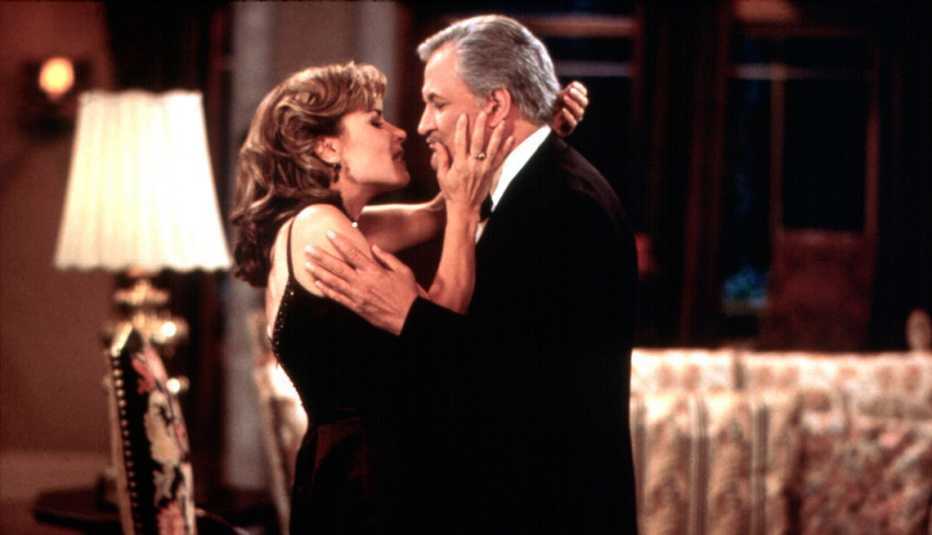 Lauren Koslow and John Aniston embrace in a scene from Days of Our Lives