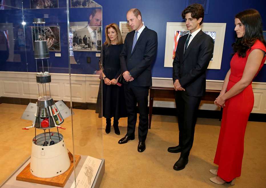 Prince William, U.S. Ambassador Caroline Kennedy, along with her children John and Tatiana Schlossberg look at a display during a tour of the John F. Kennedy Presidential Library
