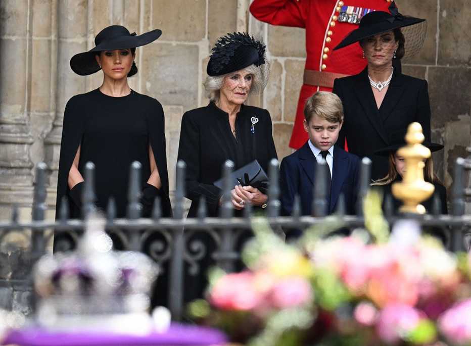 Meghan, Duchess of Sussex, Britain's Camilla, Queen Consort, Britain's Prince George of Wales and Britain's Catherine, Princess of Wales look at the coffin of Queen Elizabeth II