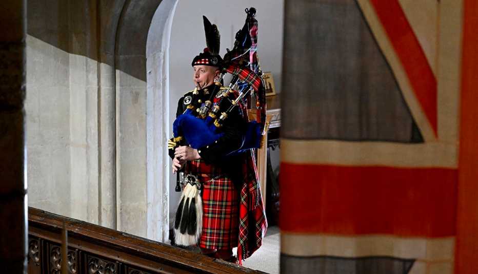 Pipe Major Paul Burns of the Royal Regiment of Scotland performs on the bagpipes at the state funeral for Queen Elizabeth II
